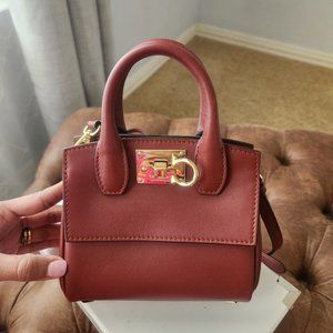 Salvatore Ferragamo: Deep red purse